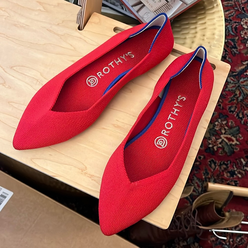 Rothy’s pointed flats, bright red. New, never worn.